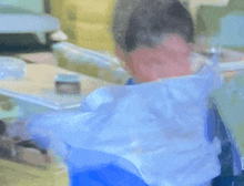 a blurry painting of a person with a blue shirt on