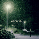 a man is standing in the snow with the words when yh written above him