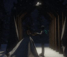 a bride and groom are holding hands in a dark forest