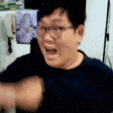 a man wearing glasses is making a funny face with his mouth open