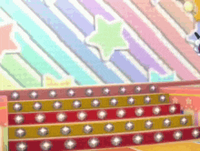 a row of stairs with a rainbow background and a star on top