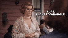 a woman says sure i love to wrangle and shakes a man 's hand