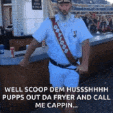 a man with a beard is standing in front of a bar wearing a sash that says obvious .