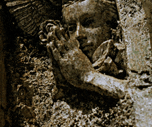a statue of a woman with her hands folded praying