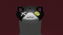 a black and white cat with a smiley face and a cross on its eyes