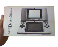 someone is holding a box for a nintendo double games