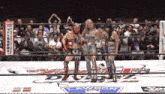 three women in a wrestling ring with a lawson logo on the floor