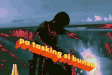 a person is holding a sign that says " pa tasking si bunso "