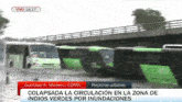 a row of green and white buses are parked under a bridge with a headline that says gustavo a. madero