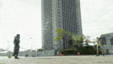 a man standing in front of a tall building with a sword