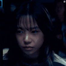 a close up of a woman 's face with a star above her