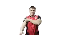 a man in a red and black jersey with the number 2 on it flexes his muscles