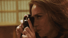 a woman takes a picture with a camera
