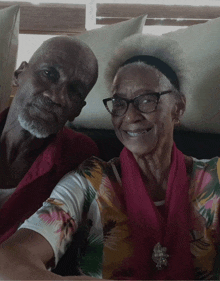 a man and woman are posing for a picture together