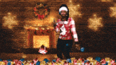 a man wearing an ugly christmas sweater stands in front of a fireplace surrounded by presents