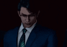 a man in a suit and tie is covering his mouth with his hand