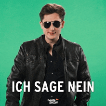 a man wearing sunglasses and a leather jacket has ich sage nein written in white letters