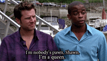 two men standing next to each other with one saying i 'm nobody 's pawn
