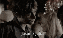 a man and a woman are kissing in a black and white photo with the words `` jason x julian '' .