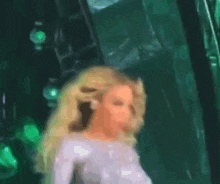 a blurry picture of a woman in a white top