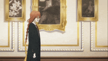 a man in a suit stands in front of a painting
