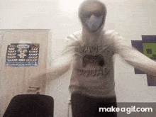 a man wearing a gamer squad shirt is dancing with his arms outstretched