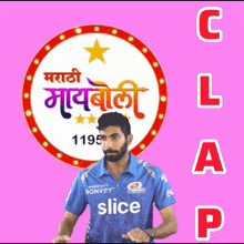 a man in a blue slice jersey stands in front of a pink background