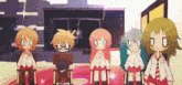 a group of anime characters are standing in front of a blackboard with the letters o and x on it
