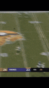 a football player wearing a number 14 jersey is running on the field