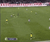 a soccer game is being played in a stadium with a sign that says " live "