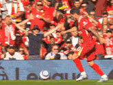 a soccer player in a red jersey with the number 9 on it