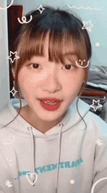 a girl wearing a white hoodie that says " i've never seen a hoodie like this before "