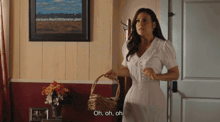 a woman holding a basket says oh oh oh