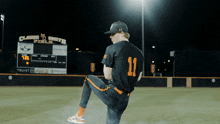 a baseball player with the number 11 on his shirt