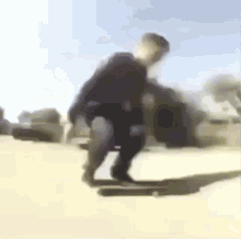 a blurry picture of a person riding a skateboard on a sidewalk .