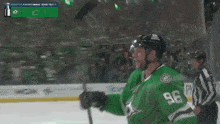 a hockey player with the number 96 on his jersey stands on the ice