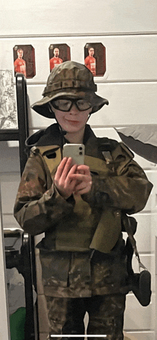 a person in a military uniform taking a picture of themselves