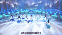 a group of women are dancing on a stage with chinese writing on it
