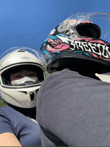 a person wearing a mask and a helmet that says breed on it