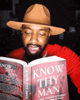 a man is reading a book titled know thy man