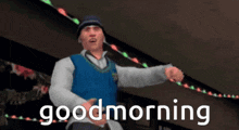 a video game character says good morning in front of a string of lights