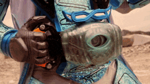 a close up of a person wearing a costume with a mask on it