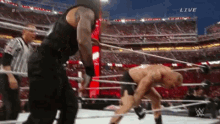 Roman Reigns Kicks GIF - Roman Reigns Kicks Brock Lesnar GIFs