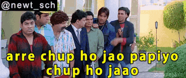a group of men are standing in front of a building with a caption that says arre chup ho jao papiyo