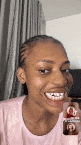 a woman in a pink shirt is smiling with a picture of a woman behind her that says tik tok