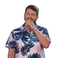 a man wearing a name tag that says ryan