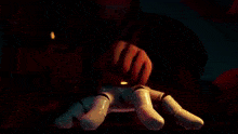 a close up of a person playing a video game with a controller .