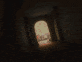 a shadow of a person is cast on a wall in the dark