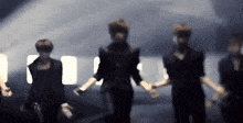 a blurry photo of a group of people dancing