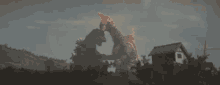 a giant monster is fighting a smaller monster in a field in front of a house .
